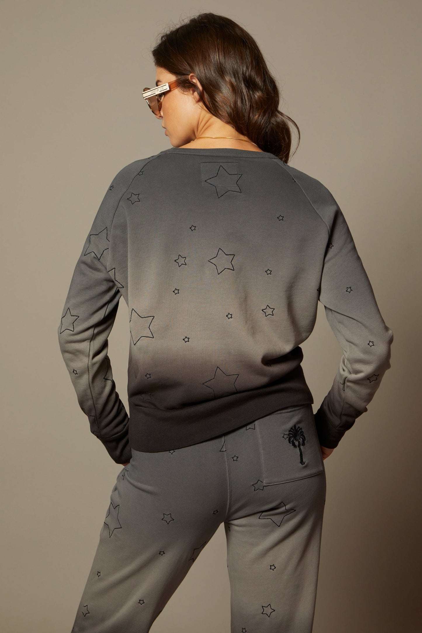 THE SABINE SWEATSHIRT IN MIDNIGHT OMBRE DYE WITH ALL OVER STAR EMBROIDERY