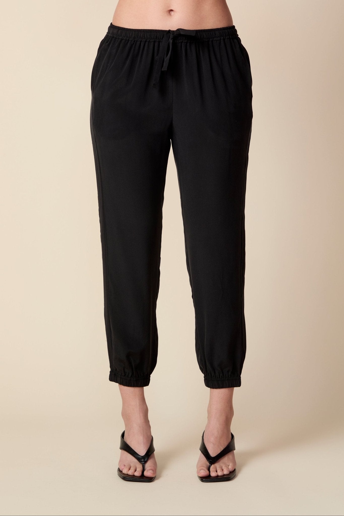 THE OLIVIA SILK JOGGER IN BLACK - ROYAL PALMS love & legacy