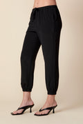 THE OLIVIA SILK JOGGER IN BLACK - ROYAL PALMS love & legacy