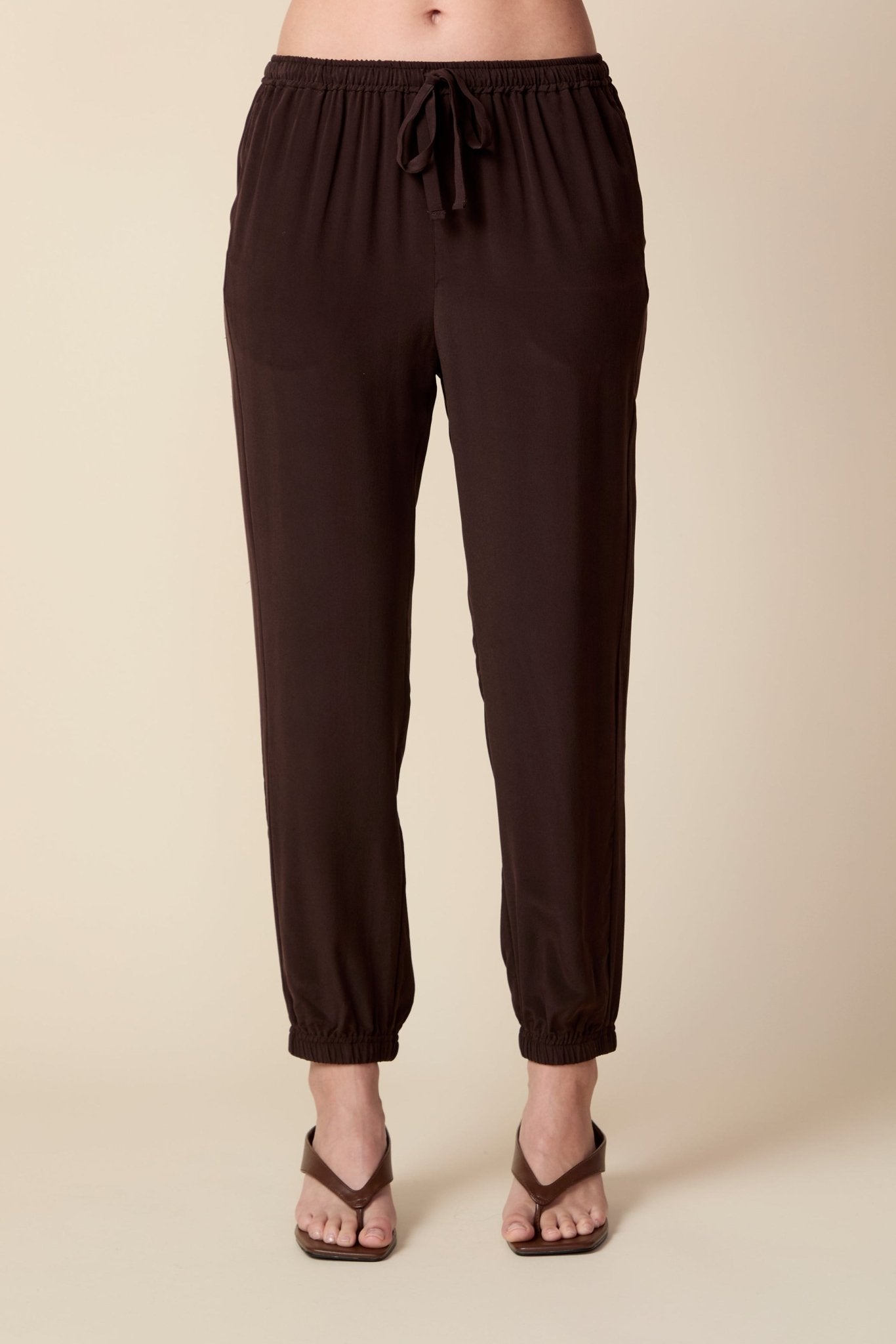 THE OLIVIA SILK JOGGER IN COFFEE BEAN BROWN - ROYAL PALMS love & legacy