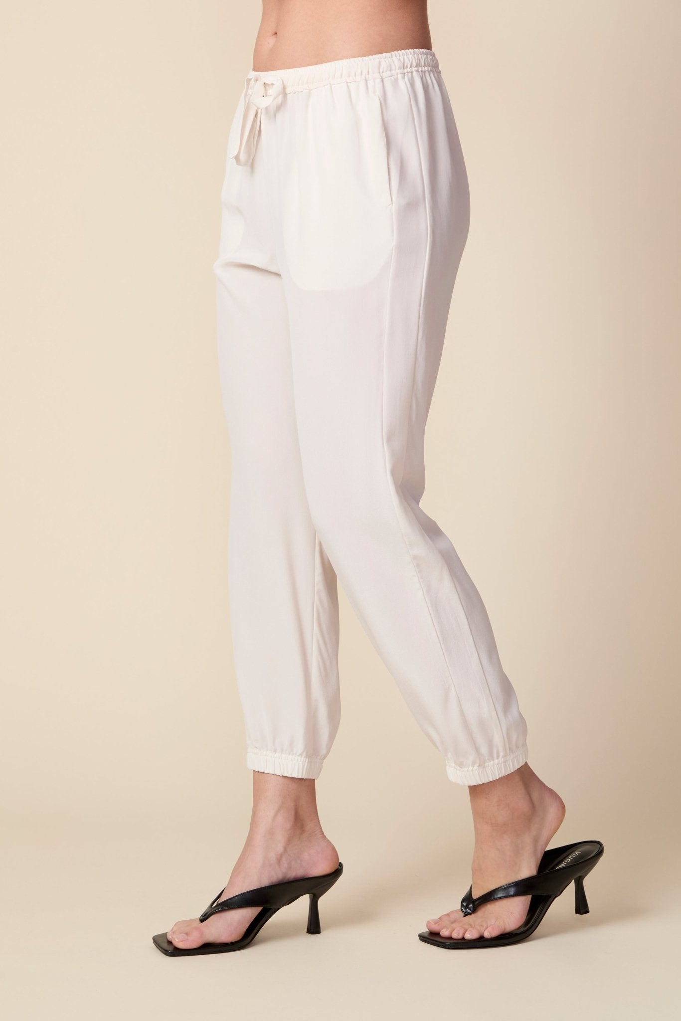 THE OLIVIA SILK JOGGER IN GARDENIA - ROYAL PALMS love & legacy