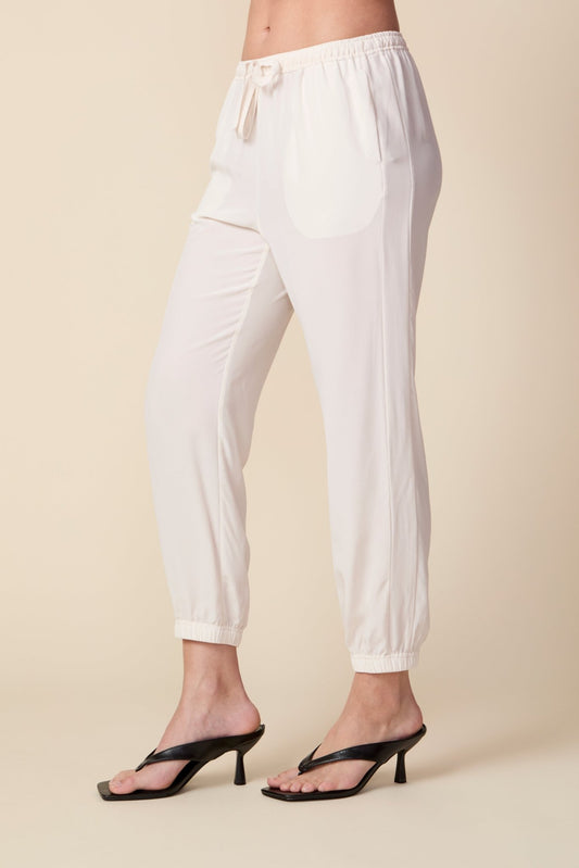 THE OLIVIA SILK JOGGER IN GARDENIA - ROYAL PALMS love & legacy